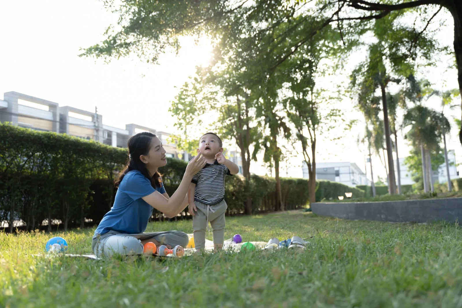 Caregiver and child playing outdoors